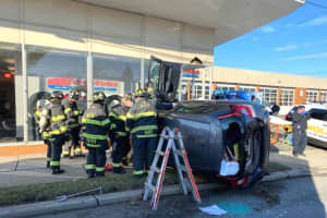 SUV Rolls Into Hackensack Auto Shop In Cut-Off Crash, Customer Hit By Flying Glass
