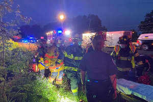 Driver Taken To Trauma Center As Car Plunges Down Embankment Into Hunterdon County Pond: PHOTOS