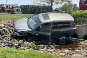 Car Crashes Into Brook, Leaks Fluid In Hartford County