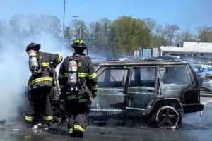 Hero UPS Driver Moves Fiery Jeep Away From Other Cars