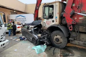 One Critical Following Head-On Garbage Truck Crash