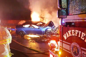 Tesla Erupts In Flames After Wakefield Crash