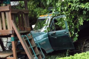 Out-Of-Control Dump Truck Crashes Into Ridgewood Backyard Play Set