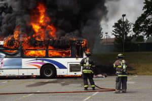 PHOTOS: Fire Destroys Unoccupied Commuter Bus Outside Bergen Community