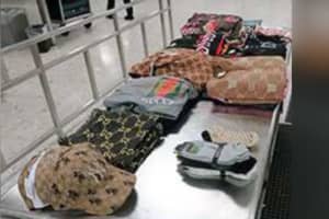 Maryland Woman Caught Sneaking $500,000 Worth Of Knock-Off Clothes At Virginia Airport