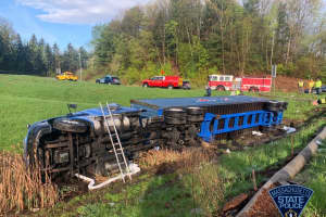 Tractor-Trailer Flips On Side After Rolling Off Mass Pike In Auburn: Police