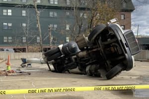 Person Injured After Cement Mixer Falls Through Parking Lot Deck In Danbury