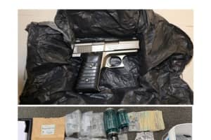 Handgun, Heroin Seized By Area Police