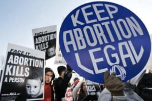 Abortion Ruling: Man Scales D.C. Bridge, Protestors Bang Drums At Justice's Home