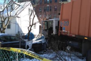 Runaway Garbage Truck Slams Car, Damages House In Mount Vernon
