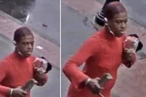 Newark Police Seek ID Of Person In Red Dress Who Hit Victim Over Head With Brick