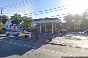 Customer Leaves Area Gas Station With Fuel Nozzle Still Attached To Vehicle