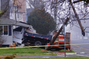 Dump Truck Plows Into Jersey Shore Home, Downs Power Lines