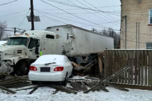 Wrong-Way Tractor Trailer Crosses Double-Yellow Lines, Traps Woman In Building: Bridgewater PD
