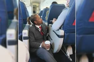 Viral Photo Shows 'Gem' Flight Attendant Comforting Nervous Flier On Trip To JFK