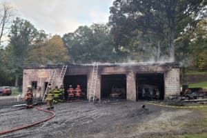 Several Cars Destroyed In Three-Bay Maryland Garage Fire, Officials Say