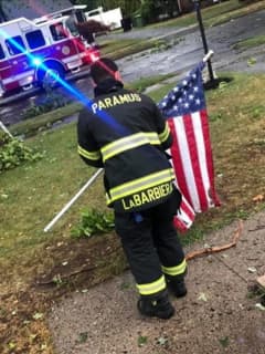 Resident: Paramus Firefighter Raises Fallen Stars And Stripes During Storm