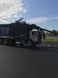 Garbage Truck Crashes Into Utility Pole In Ulster