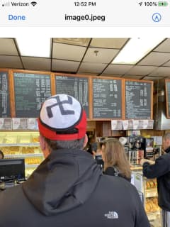Man Wearing Baseball Cap With Swastika Escorted By Police Out Of Westchester Diner