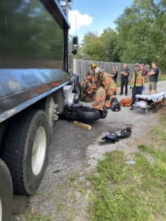 Motorcyclist Trapped Under Dump Truck In Montgomery County Crash Near School (DEVELOPING)