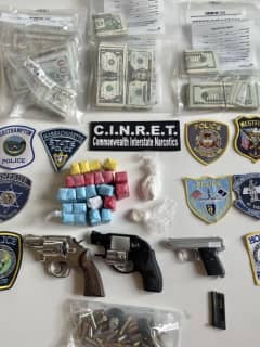 Duo Charged After Drugs, Weapons, Cash Seized In Bust In Region