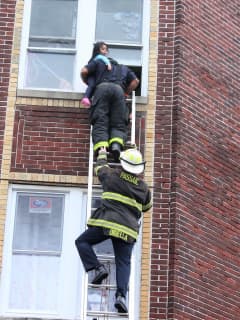 PHOTOS: Firefighters Rescue Mother, Child From Burning Passaic Building