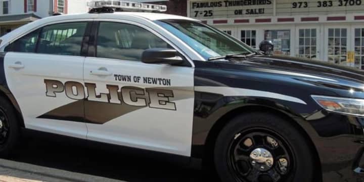 A 31-year-old Newton woman was arrested on a warrant after police say she stole a laptop from a local house.