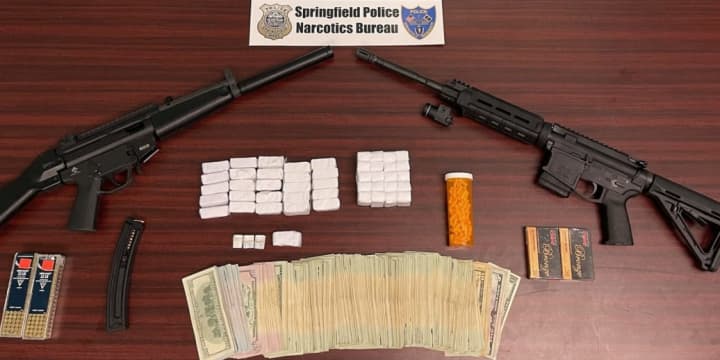 Police in Springfield busted an alleged drug distributor with heroin, cash, and illegal weapons.