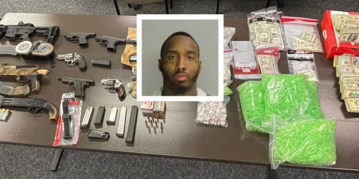 Nine guns and a pound of crystal meth were seized from Philadelphia drug dealer Larry &quot;Gunna&quot; Lamar Hudson, authorities said.