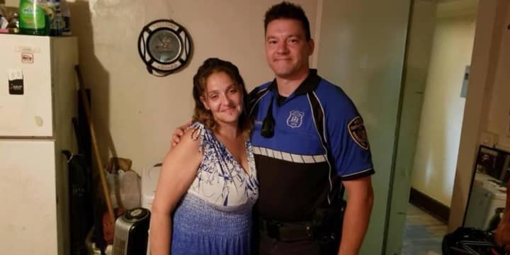 Officer Jim Schoenleber and the woman whose life he helped save.