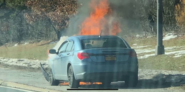 Traffic was slowed on the Southern State Parkway as a car fire burned.