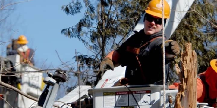 Orange &amp; Rockland is warning customers to beware of phone fraudsters pretending to be employees of the utility. O&amp;R crews, above, work on power lines.