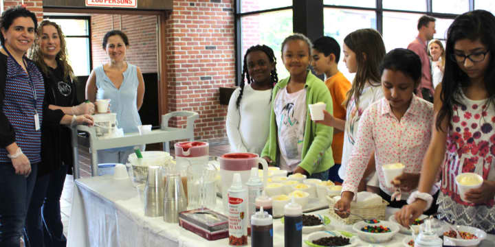 Pocantico Hills students enjoy an ice cream party for donating to the needy.