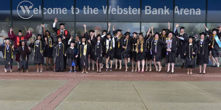 Graduates of Western Connecticut State University celebrate receiving their diplomas on Sunday, May 22.