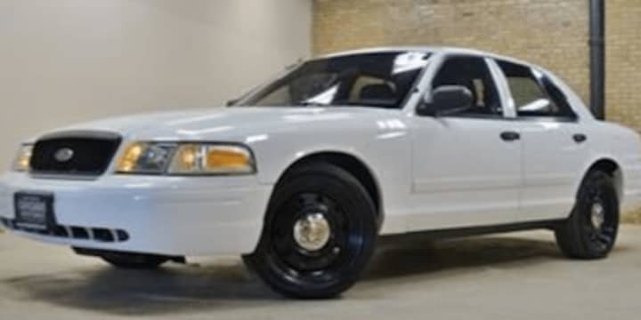 An older model Ford Crown Victoria, similar to the one involved in the incident.