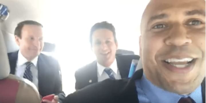 Sens. Chris Murphy of Connecticut, Brian Schatz of Hawaii and Cory Booker of New Jersey broadcast on Facebook Live from inside a cab.