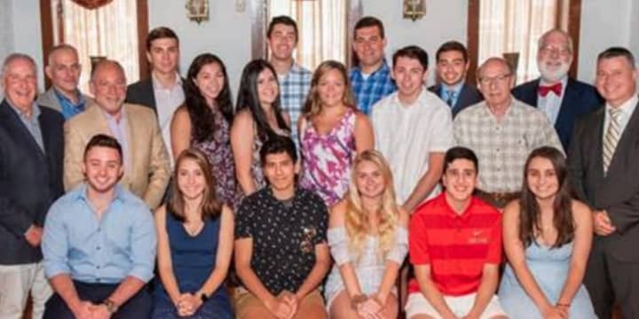 Juliet DeNapoli, 18, of Long Island (Second student seated from left) is one of 17 students in the region to be rewarded with a $5,000 scholarship from the Louis G. Nappi Construction Labor-Management Scholarship Fund.