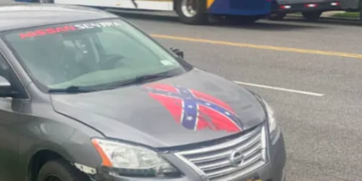 A construction worker has been barred from a Capital District school after twice showing up to campus in a vehicle donning a Confederate flag.