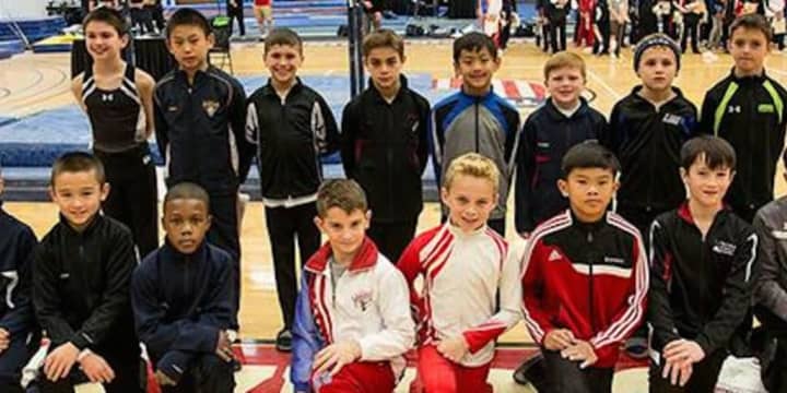 Eli Osuna, pictured third from left in the top row, poses for a photo with the 10-year-old Junior National Team.