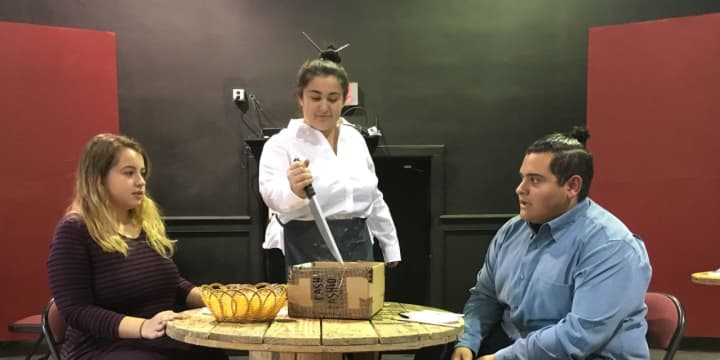 A couple&#x27;s dinner gets ruined when their fortune cookie has a disturbing message. The performance cast includes, from left, Chloe Blaney, Deanna Prekpalaj and Jovani Perez.