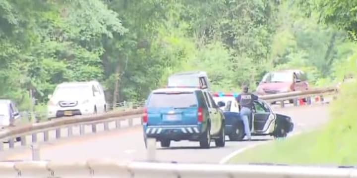Westchester County police at the scene of Sunday&#x27;s fatal accident on the Saw Mill River Parkway. A 30-year-old White Plains man has been identified as the  crash victim.