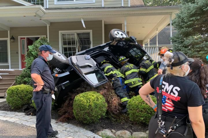 Photos: Vehicle Overturns After Crashing Into House In Area