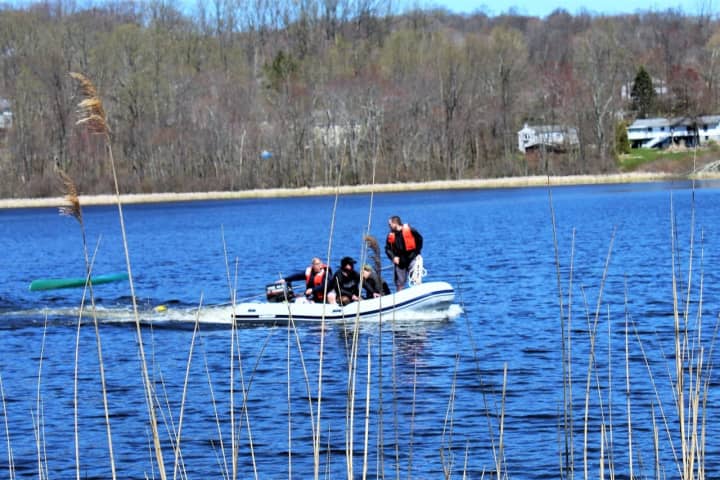 Photos: Two Rescued From Capsized Boat In Area Lake