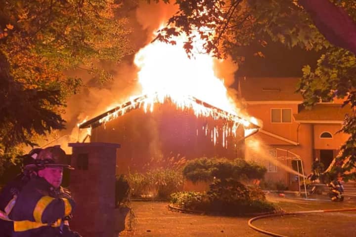Fire Destroys Three-Car Garage Of Melville Home
