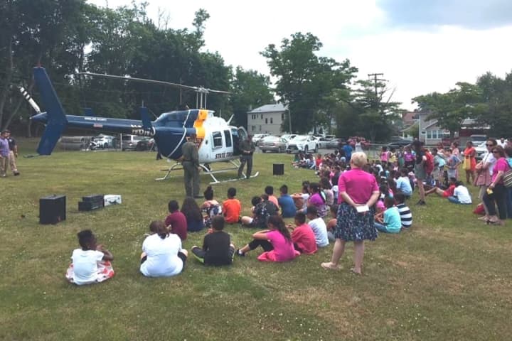 Englewood Police Treat Youngsters To Helicopter, Free Backpacks