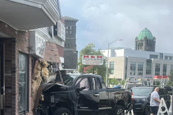 Man Crashes Truck Into Cars, Building Before Running Away In Taunton