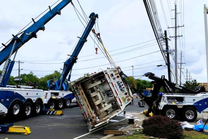 Heavy-Duty Wreckers Remove Tipped Garbage Truck From Jammed Route 17