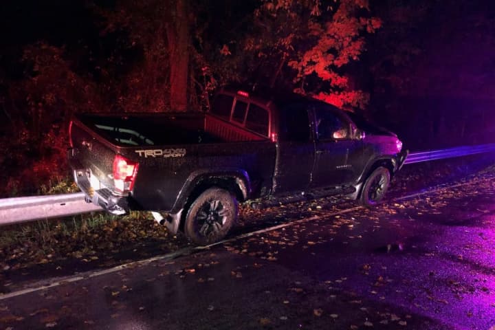 Pickup Truck Gets Stuck On Guardrail After DWI Driver Crashes