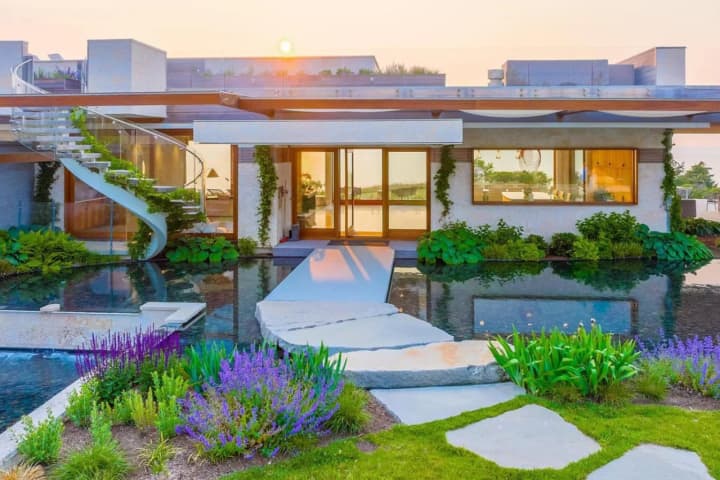 $26M 'Breathtaking' Mass Beachfront Mansion Comes With Waterfall, Sauna, Rooftop Infinity Pool