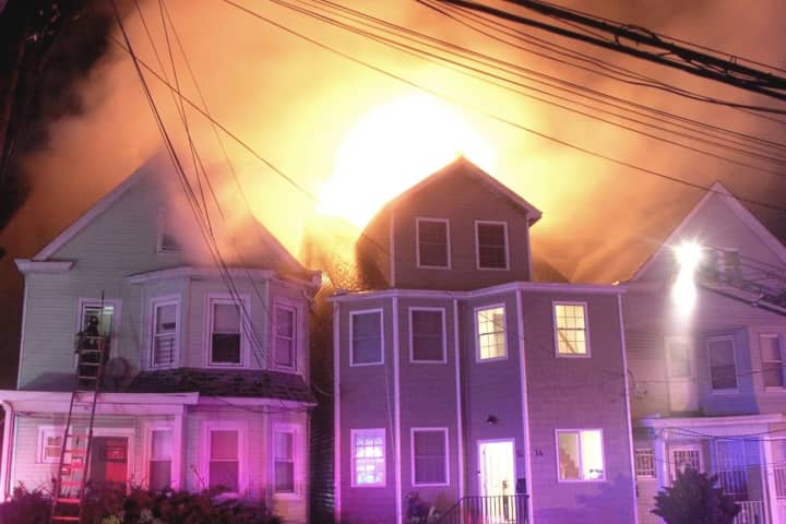 Fire Races Through Row Of Paterson Homes